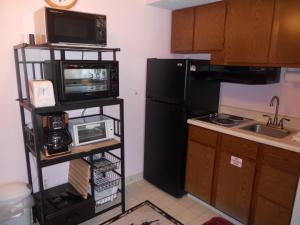 a kitchen with black appliances and a black refrigerator at Oak Square 309 in Gatlinburg