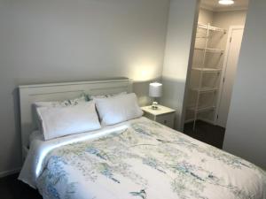 Кровать или кровати в номере Central Stadium Apartments