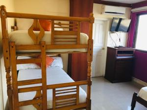 Postel nebo postele na pokoji v ubytování Hotel Fika Guayaquil