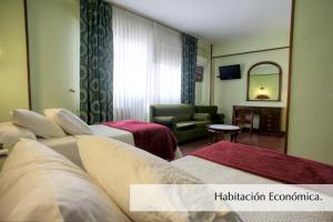 Postel nebo postele na pokoji v ubytování Hotel Montermoso