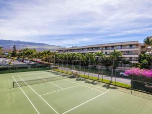 a tennis court in front of a hotel at 1 BD King Suite: 40% OFF, Beach Walk in Wailea