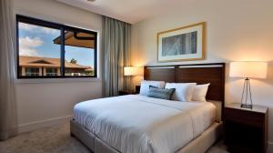 a bedroom with a large bed and a large window at Maui Westside Presents: Luana Garden Villas 14D in Kaanapali +53 photos