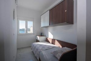 Posteľ alebo postele v izbe v ubytovaní Apartments Osti
