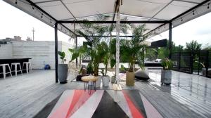 a patio with potted plants on a roof at Seoul Loft Apartments - SLA 7 Night Minimum in Seoul