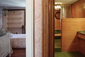 Cama o camas de una habitación en Apartamentos María Luisa
