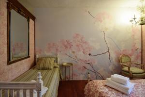 Cama o camas de una habitación en Apartamentos María Luisa