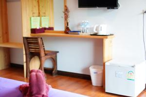 a person with their feet up on a bed at Green Two Resort in Chanthaburi +53 photos