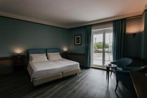 Postel nebo postele na pokoji v ubytování Hotel Del Campo