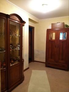 a room with a wooden cabinet and a door at B&B VRANSKO29-Room1960 in Vransko