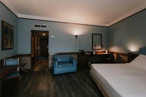 Postel nebo postele na pokoji v ubytování Hotel Del Campo