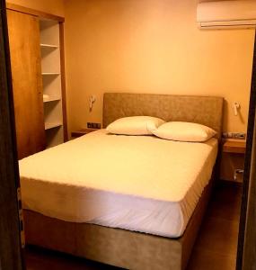 A bed or beds in a room at StelDi Luxury Apartments