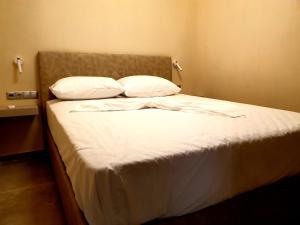 A bed or beds in a room at StelDi Luxury Apartments