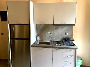 A kitchen or kitchenette at StelDi Luxury Apartments