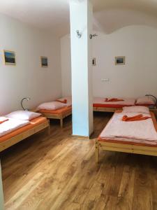 En eller flere senge i et værelse på Apartmán v Zahradní