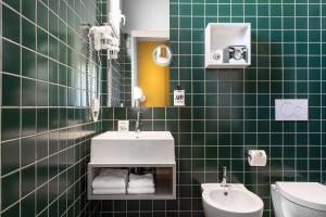 Een badkamer bij Up Hotel