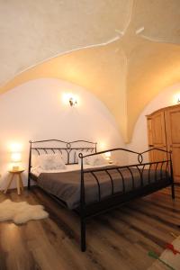 a bedroom with a bed with a star on the ceiling at Gothic Apartment in Braşov