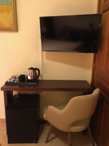 TV a/nebo společenská místnost v ubytování Hostal Loreto