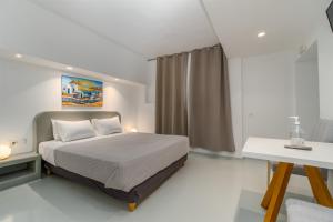 Voodi või voodid majutusasutuse Central Fira Suites toas