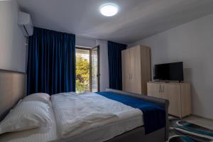 Postel nebo postele na pokoji v ubytování Simona Apartaments