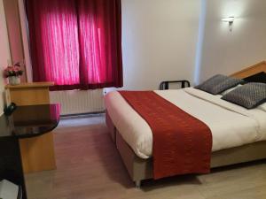 Letto o letti in una camera di Hotel New Flanders