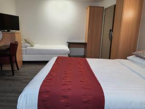 Letto o letti in una camera di Hotel New Flanders