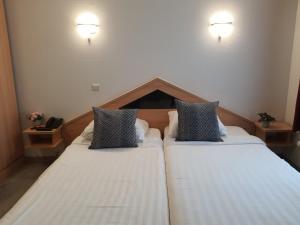 Letto o letti in una camera di Hotel New Flanders