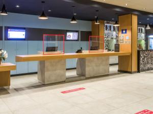 The lobby or reception area at Ibis Americana