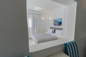 Voodi või voodid majutusasutuse Central Fira Suites toas