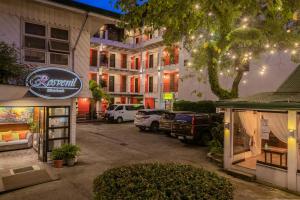 a parking lot in front of a building at Rosvenil Hotel in Tacloban