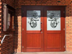 a pair of doors on a brick building at Nordseehotel Eymers in Nordholz