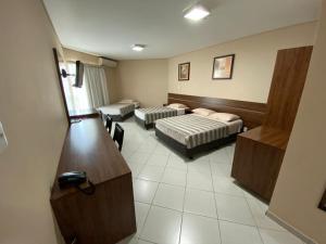 Ένα ή περισσότερα κρεβάτια σε δωμάτιο στο Flamboyant Suite Hotel
