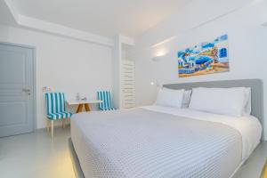 Voodi või voodid majutusasutuse Central Fira Suites toas