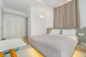 Voodi või voodid majutusasutuse Central Fira Suites toas