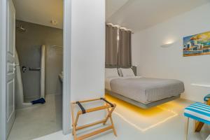 Voodi või voodid majutusasutuse Central Fira Suites toas