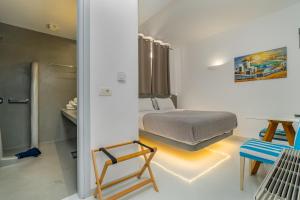 Voodi või voodid majutusasutuse Central Fira Suites toas