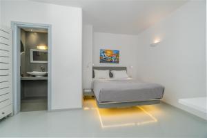 Voodi või voodid majutusasutuse Central Fira Suites toas
