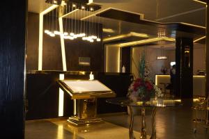 a room with a piano and a table in it at ALJAWHARA ALZARQAA FOR SERVICED APARTMENTS Est 2 in Rabigh +73 photos