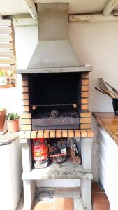 an outdoor oven with some food inside of it at Casa cueva Bandama con jacuzzi in Tafira