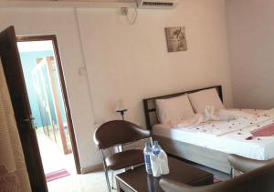 Uma cama ou camas num quarto em Mahoya