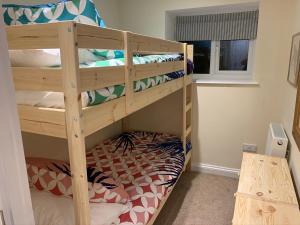 a bunk bed room with two bunk beds at Salty Toes in Paignton