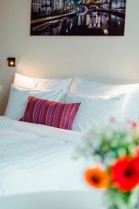 Postelja oz. postelje v sobi nastanitve Heirloom Hotels - The House of Edward