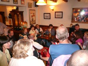 a group of people sitting in a room at O'Donnabhain's in Kenmare