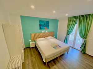 Postel nebo postele na pokoji v ubytování Mimì Rooms&Studios