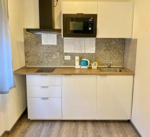Kuchyň nebo kuchyňský kout v ubytování Mimì Rooms&Studios