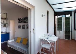 a living room with a couch and a table at MilanoView Apartment in Milan