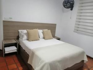 Postel nebo postele na pokoji v ubytování Hotel 42 Avenida