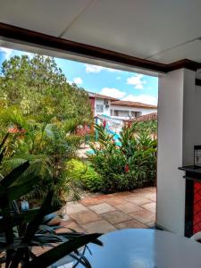 a view of a patio from an open window at Hotel Portal De Eunápolis in Eunápolis