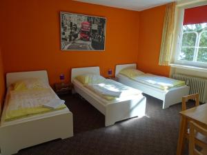 Ein Bett oder Betten in einem Zimmer der Unterkunft Gästehaus Grupello