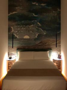 
a painting of a bed in a hotel room at Relais Villa Montedonzelli in Naples
