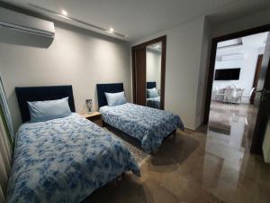Un pat sau paturi într-o cameră la Abilia Soukra